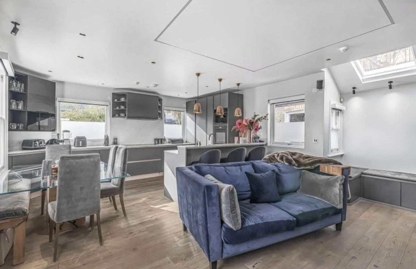 Imperial Wharf open-plan living, dining and grey kitchen with blue velvet sofa