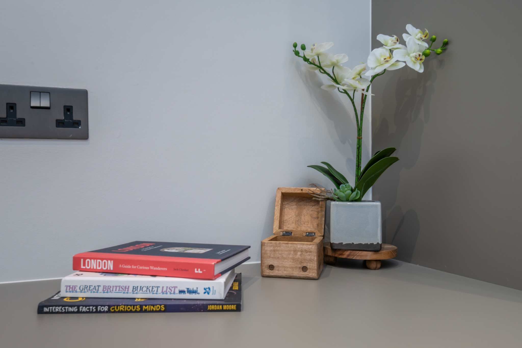 Portobello Road interior styling with orchid, books and timber accessories